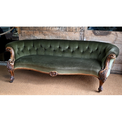 106 - A green button back draylon upholstered Victorian walnut framed serpentine front sofa, on castors. a... 