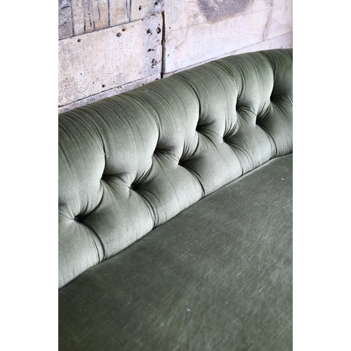 106 - A green button back draylon upholstered Victorian walnut framed serpentine front sofa, on castors. a... 