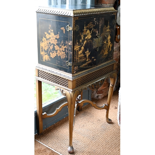 108 - A mid-century Georgian style black Japanned and gilt pictorial cabinet on stand, the twin doors encl... 