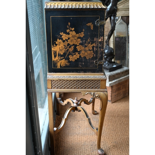 108 - A mid-century Georgian style black Japanned and gilt pictorial cabinet on stand, the twin doors encl... 