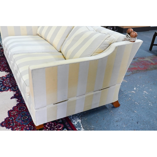 117 - A pair of contemporary Duresta 'Trafalgar' design three seat sofas, in striped fabric, raised on bra... 