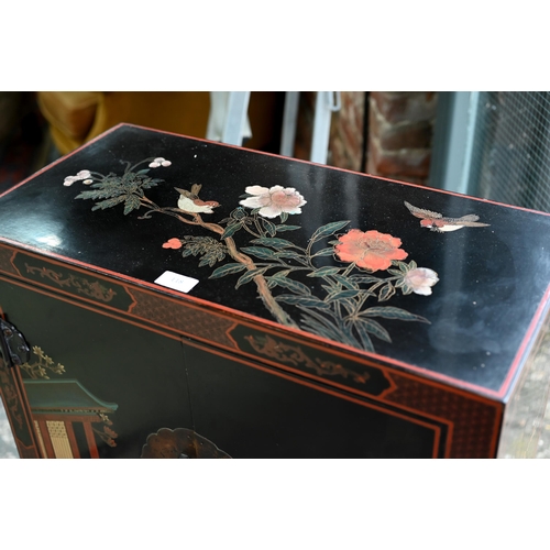 118 - A Japanese black lacquered and polychrome pictorial decorated cabinet, 62 cm x 31 cm x 92 cm h, lock... 