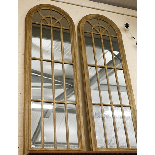 126 - A pair of large arched 'window' mirrors (2)