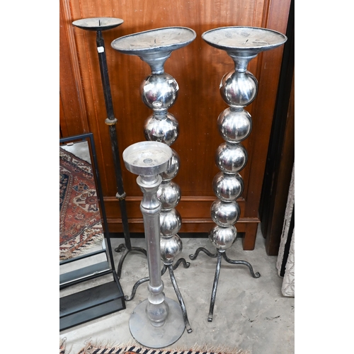 128 - # A pair of metal framed bathroom mirrors to/w four various torchere/candle stands (6)