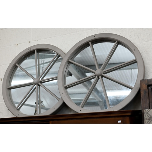 130 - A pair of 'Cartwheel' mirrors in grey painted frames, 85 cm diam