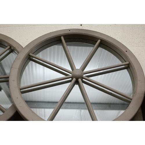 130 - A pair of 'Cartwheel' mirrors in grey painted frames, 85 cm diam