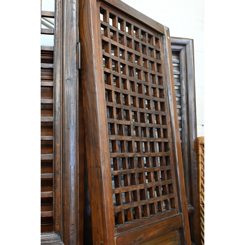 131 - A large stained hardwood four-panel screen 210 x 65 cm (each panel)