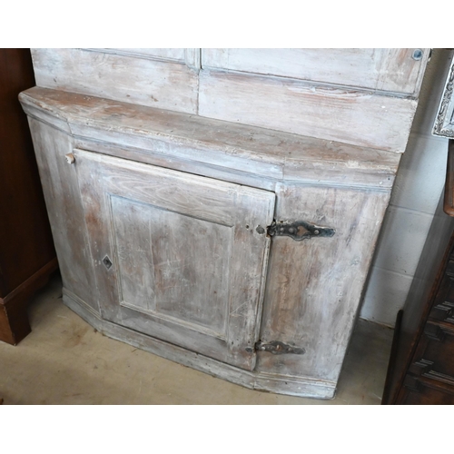 139 - A Continental antique lime washed dresser/kitchen cabinet with panelled doors, 108 cm wide x 44 cm d... 