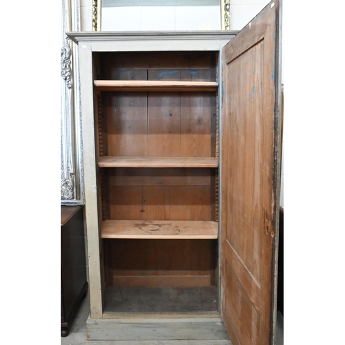 142 - A Continental antique painted pine pantry cupboard with full length panelled door enclosing shelved ... 