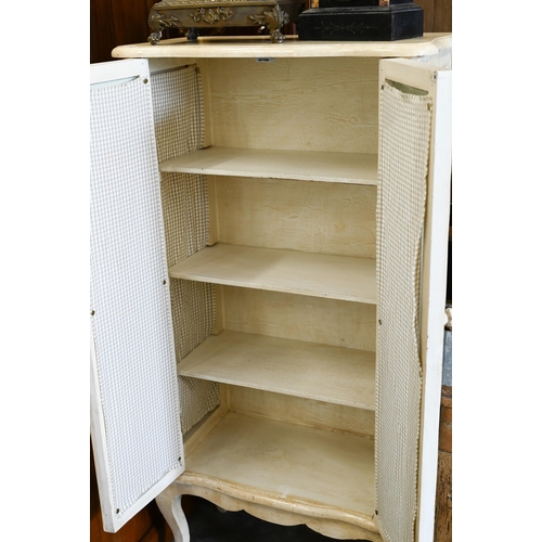 148 - A French cream painted cabinet with glazed doors and side panels, shelved interior, cabriole support... 