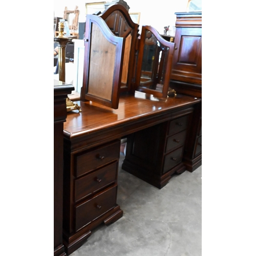 151 - A modern stained hardwood dressing table with bevelled triptych mirror and nine drawers, 150 cm wide... 