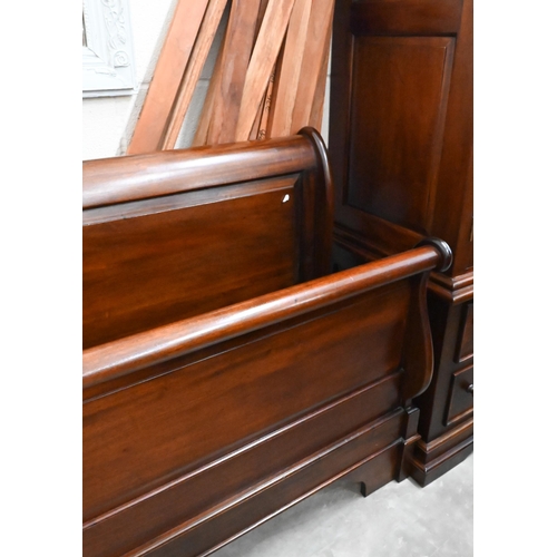 154 - A modern stained hardwood super king size sleigh bed frame, 190 cm wide