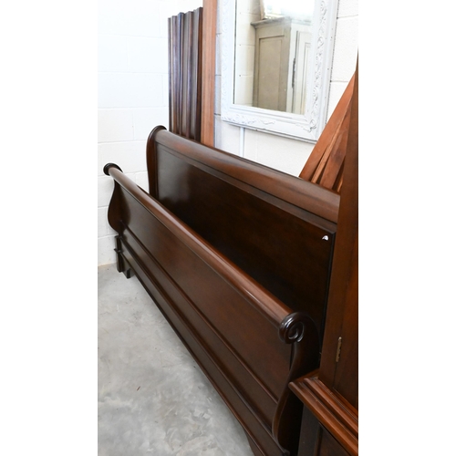 154 - A modern stained hardwood super king size sleigh bed frame, 190 cm wide