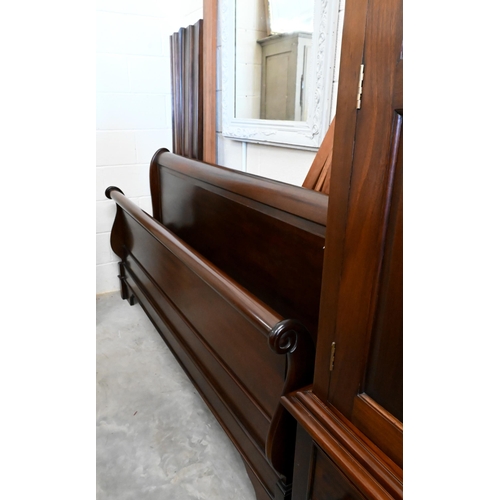 154 - A modern stained hardwood super king size sleigh bed frame, 190 cm wide