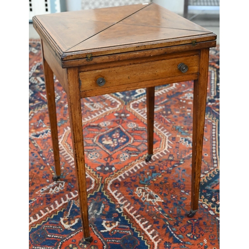 158 - An Edwardian walnut crossbanded envelope card table with frieze drawer and tapering square supports ... 