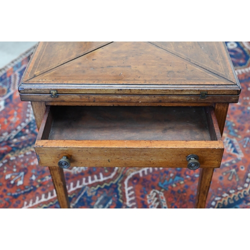 158 - An Edwardian walnut crossbanded envelope card table with frieze drawer and tapering square supports ... 