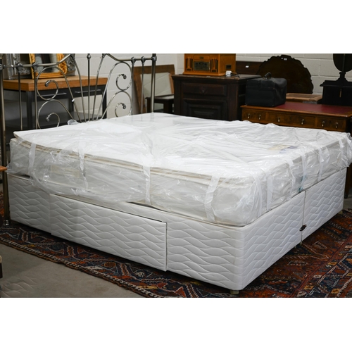 160 - A super king divan bed with Dream's Solstice medium firm mattress and metal headboard, appears littl... 