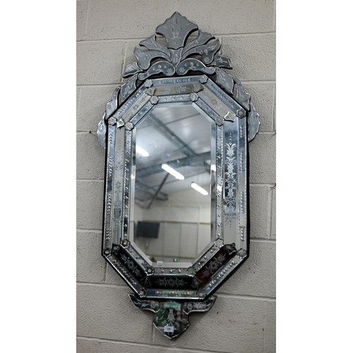 168 - A large Venetian wall mirror, 140 x 70 cm wide