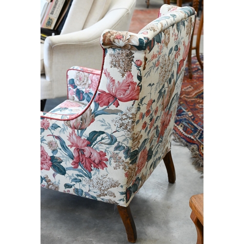 173 - A mahogany framed floral upholstered wingback bedroom chair