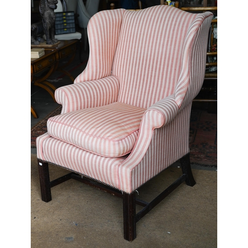 177 - A Georgian style wingback armchair, herringbone striped fabric and moulded mahogany legs