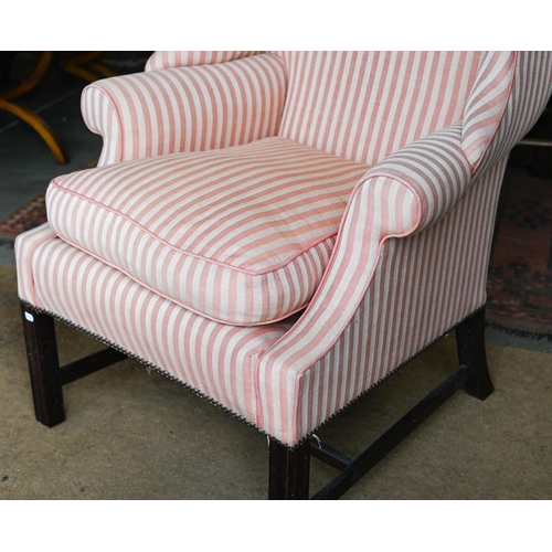 177 - A Georgian style wingback armchair, herringbone striped fabric and moulded mahogany legs