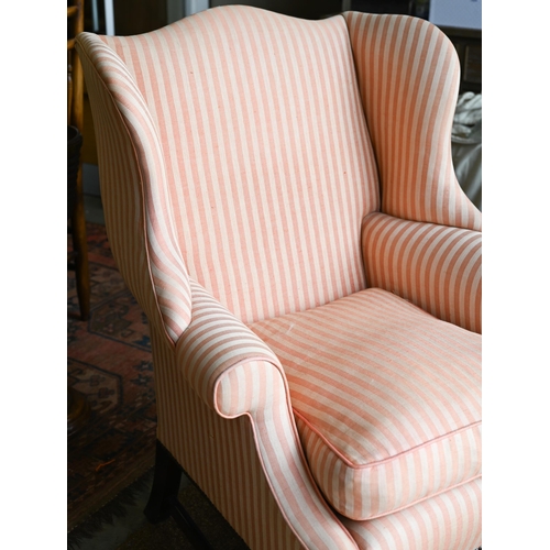 177 - A Georgian style wingback armchair, herringbone striped fabric and moulded mahogany legs