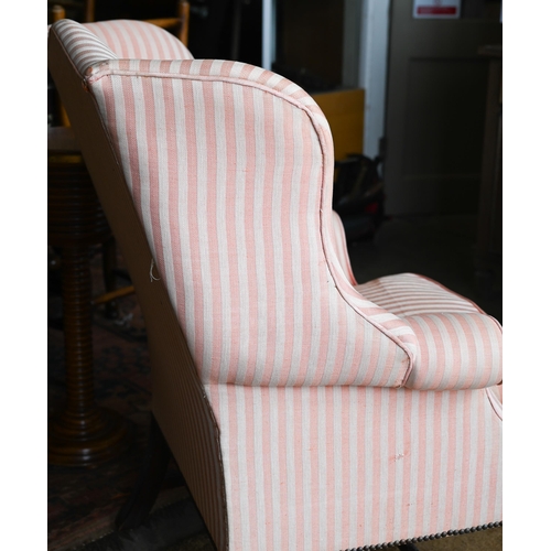 177 - A Georgian style wingback armchair, herringbone striped fabric and moulded mahogany legs