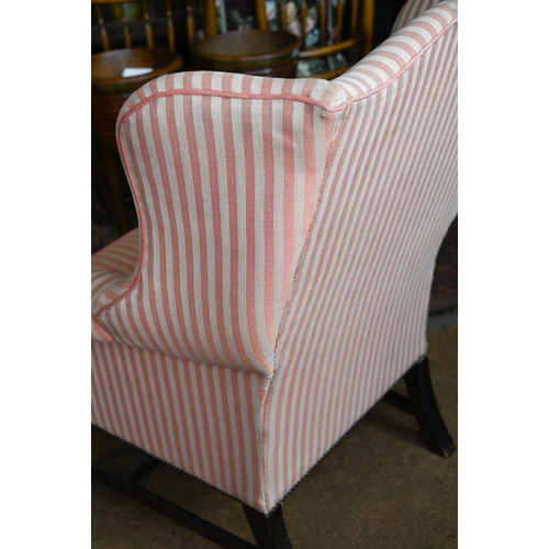 177 - A Georgian style wingback armchair, herringbone striped fabric and moulded mahogany legs