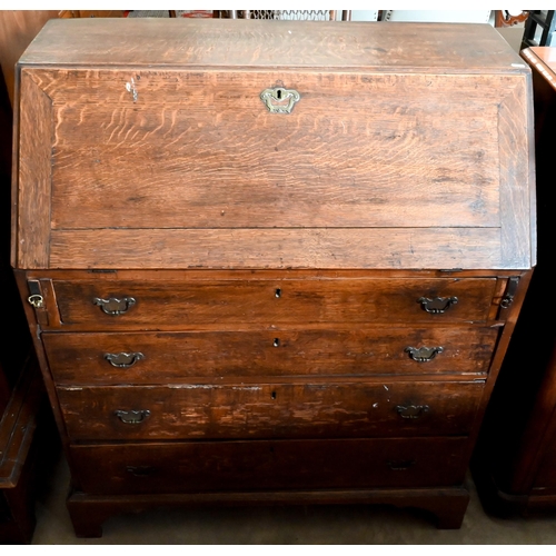 180 - A George III oak fall front bureau with fitted interior over four long graduating drawers on bracket... 