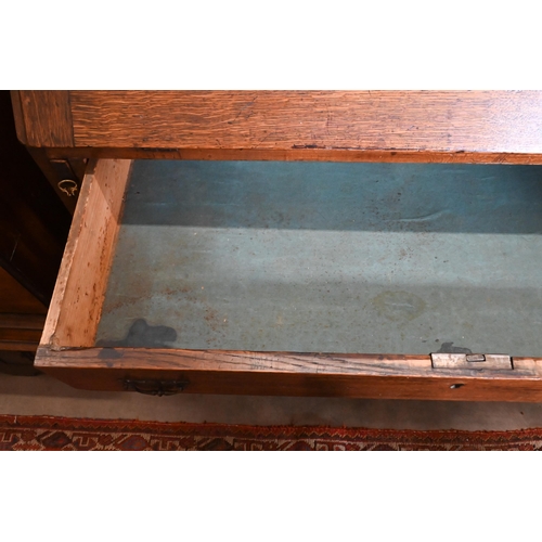 180 - A George III oak fall front bureau with fitted interior over four long graduating drawers on bracket... 