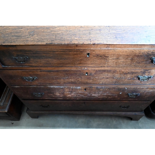 180 - A George III oak fall front bureau with fitted interior over four long graduating drawers on bracket... 