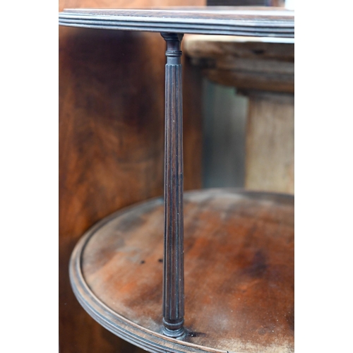 183 - A Georgian mahogany twin-tier circular dumnb waiter on turned and reeded triform base with brass cas... 