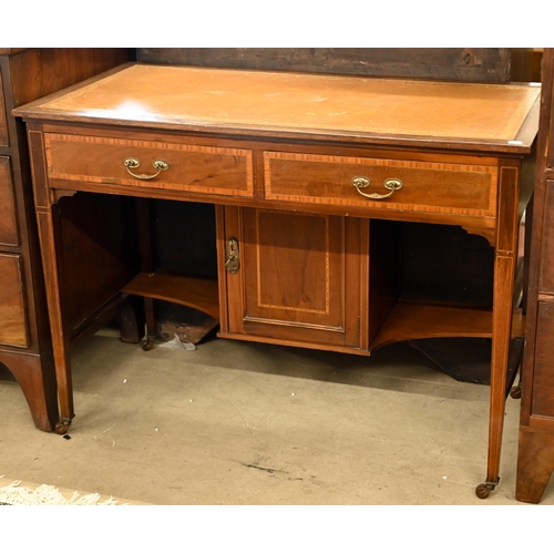 185 - An Edwardian walnut writing table with tooled tan leather top and two frieze drawers, 108 x 54 x 78 ... 