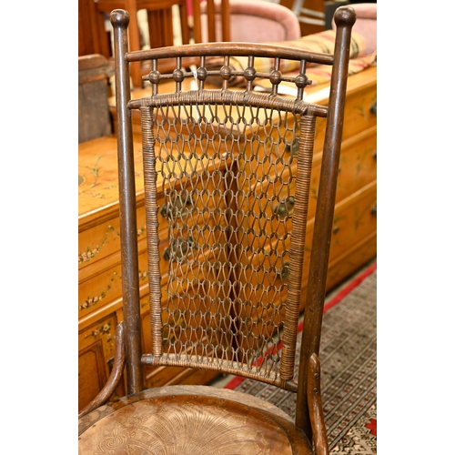 187 - An early 20th century side chair with chain mail rattan back and pressed/embossed seat