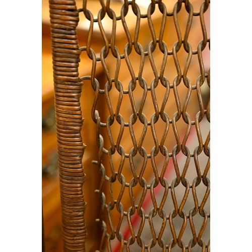 187 - An early 20th century side chair with chain mail rattan back and pressed/embossed seat