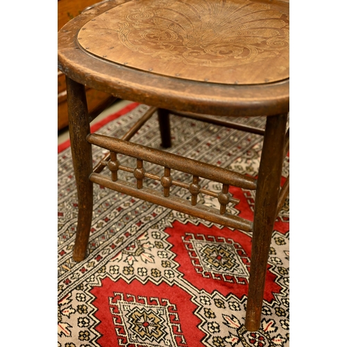 187 - An early 20th century side chair with chain mail rattan back and pressed/embossed seat