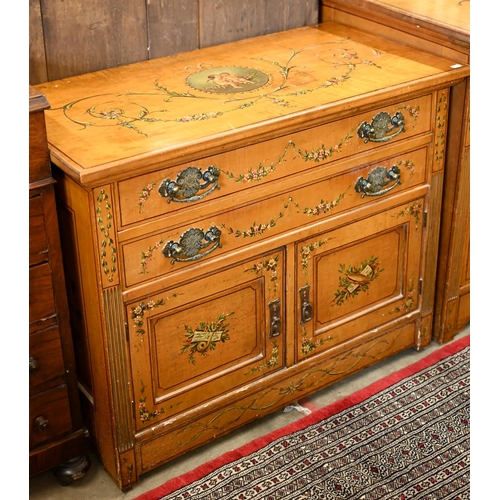 194 - A 19th century satinwood chest with two drawers over panelled cupboard doors painted with classical ... 