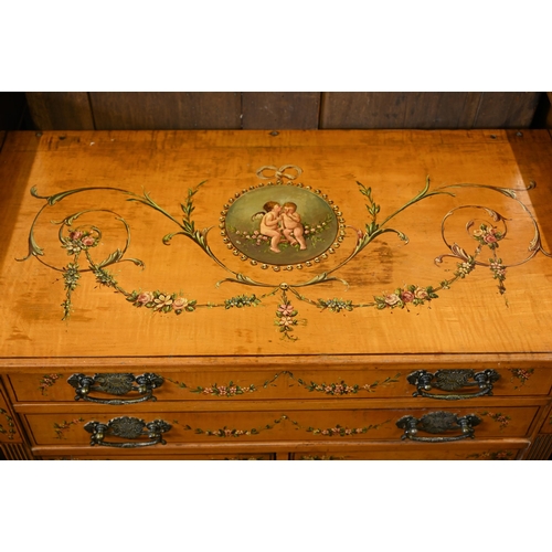 194 - A 19th century satinwood chest with two drawers over panelled cupboard doors painted with classical ... 