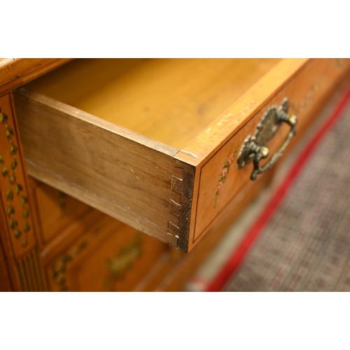 194 - A 19th century satinwood chest with two drawers over panelled cupboard doors painted with classical ... 