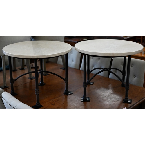 195 - A pair of circular marble top side tables on black tubular metal bases, 70 cm diam x 52 cm high