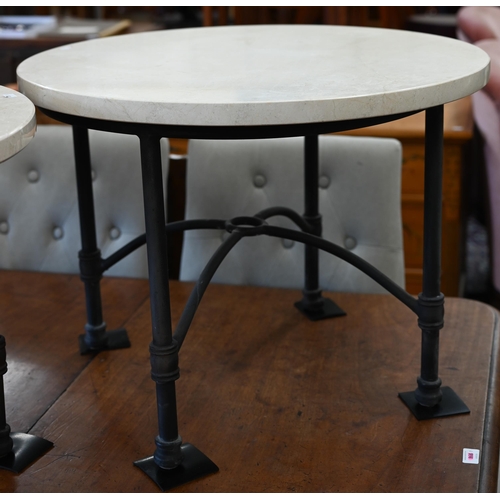 195 - A pair of circular marble top side tables on black tubular metal bases, 70 cm diam x 52 cm high