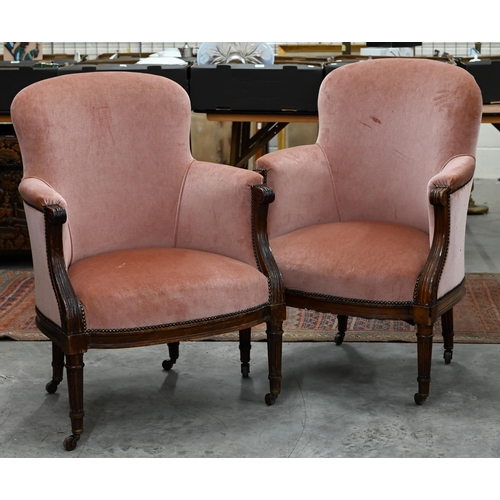 203 - A pair of Victorian mahogany framed armchairs, pink dralon upholstery (2)