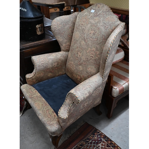 211 - # A Georgian style wingback armchair in William Morris style fabric (foam cushion removed)