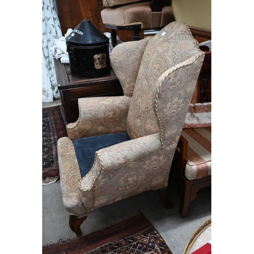 211 - # A Georgian style wingback armchair in William Morris style fabric (foam cushion removed)