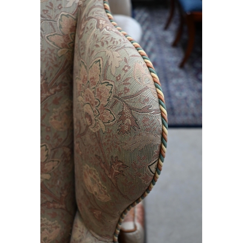 211 - # A Georgian style wingback armchair in William Morris style fabric (foam cushion removed)