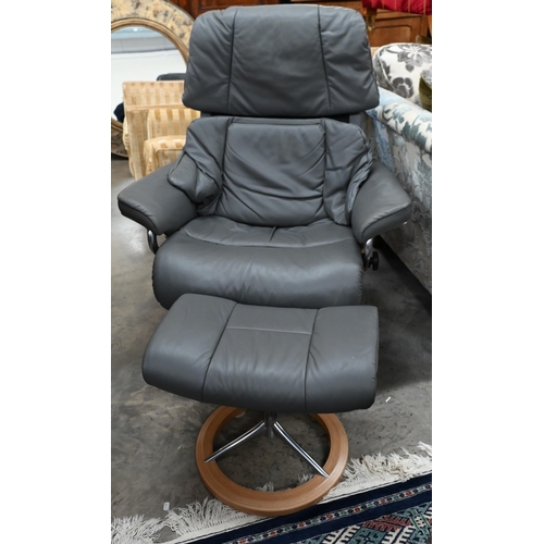 222 - A grey leather Ekornes Stressless chair and  matching footstool (2)