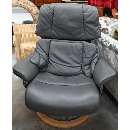 222 - A grey leather Ekornes Stressless chair and  matching footstool (2)