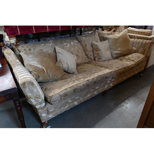 225 - A Duresta Trafalgar/knole drop arm three-seater sofa in old gold foliate fabric on hardwood supports... 