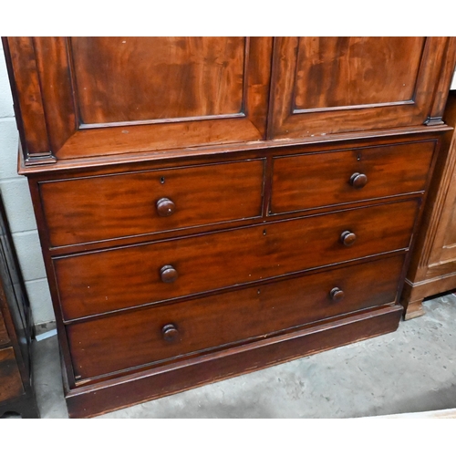 228 - A 19th century mahogany linen press, arch panelled doors enclosing hanging rail (original sides remo... 