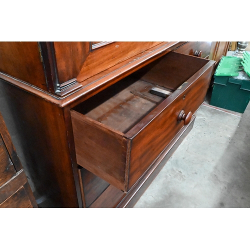 228 - A 19th century mahogany linen press, arch panelled doors enclosing hanging rail (original sides remo... 